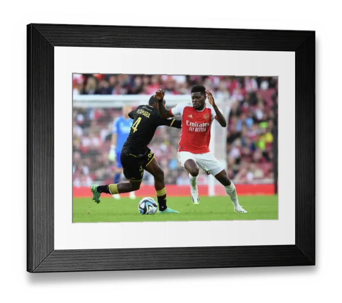 Framed Print : Arsenal vs AS Monaco: Thomas Partey Clashes with Mohamed Camara at the Emirates Cup, 2023-24