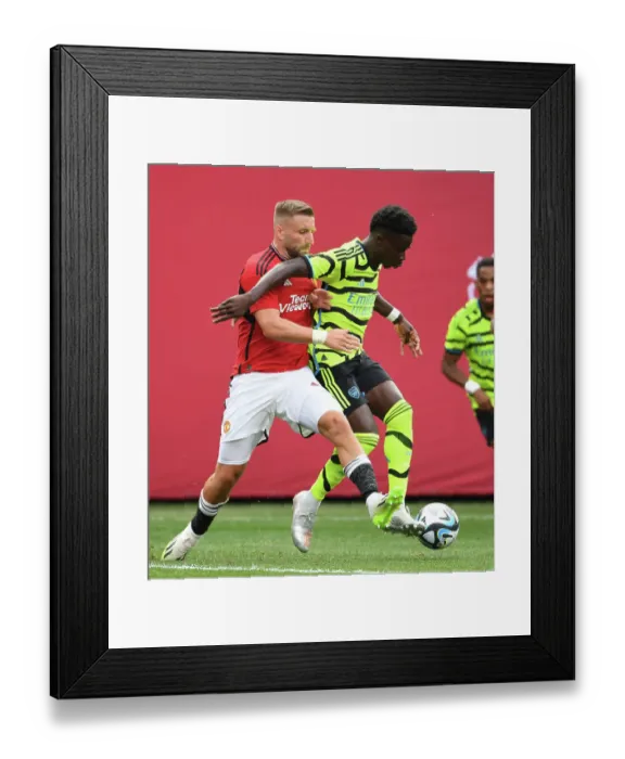Framed Print : Saka vs Shaw Showdown: Arsenal vs Manchester United at MetLife Stadium Framed Print : Saka vs Shaw Showdown: Arsenal vs Manchester United at MetLife Stadium
