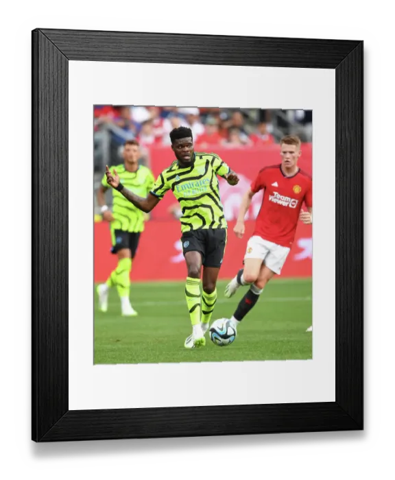 Framed Print : Thomas Partey Faces Off Against Manchester United in 2023-24 Arsenal Pre-Season Clash Framed Print : Thomas Partey Faces Off Against Manchester United in 2023-24 Arsenal Pre-Season Clash
