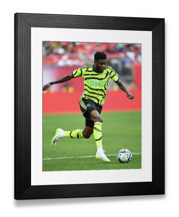 Framed Print : Thomas Partey vs Manchester United: Arsenal's Midfield Battle in 2023-24 Pre-Season Clash Framed Print : Thomas Partey vs Manchester United: Arsenal's Midfield Battle in 2023-24 Pre-Season Clash