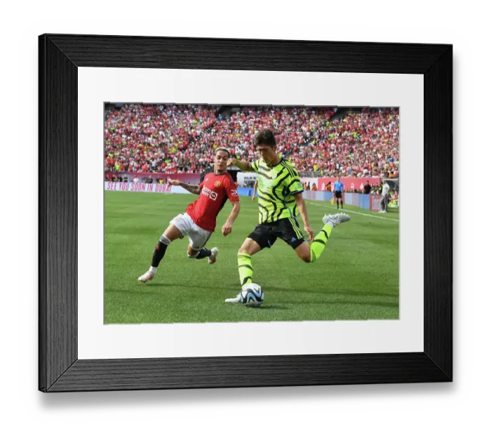 Framed Print : Tomiyasu vs Antony: Clash of the Wings at MetLife Stadium