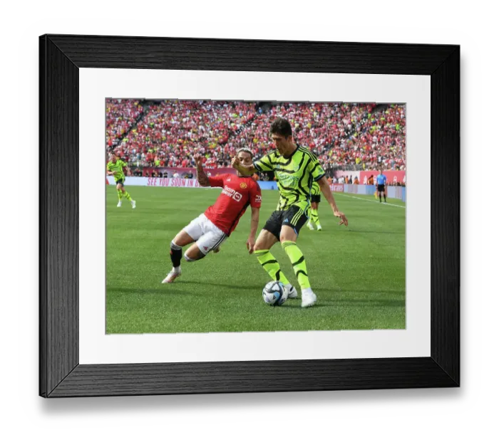 Framed Print : Arsenal's Tomiyasu Goes Head-to-Head with Manchester United's Antony in Pre-Season Showdown