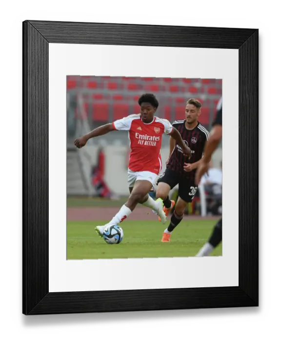 Framed Print : Arsenal's Myles Lewis-Skelly Impresses at FC Nuremberg Training