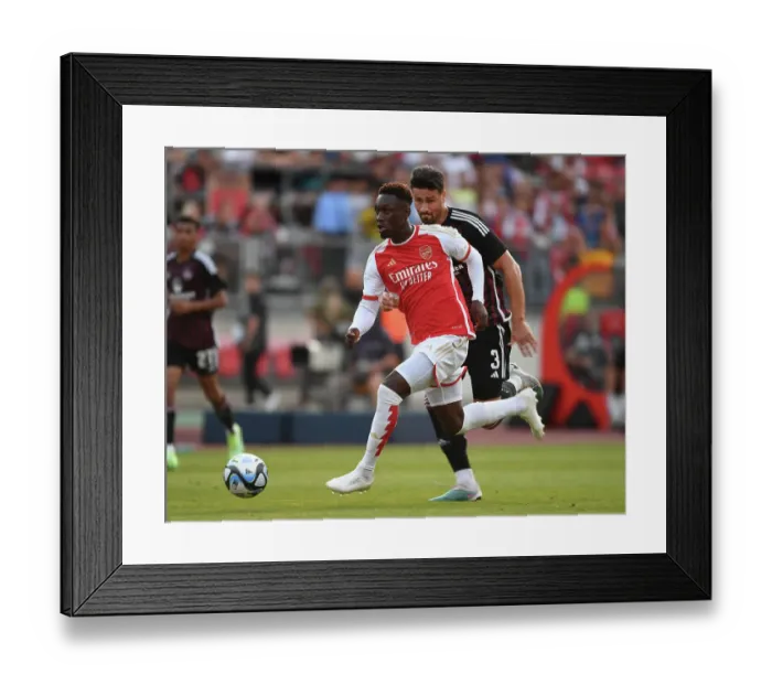 Framed Print : Arsenal's Flo Balogun in Action against FC Nurnberg in Pre-Season Friendly