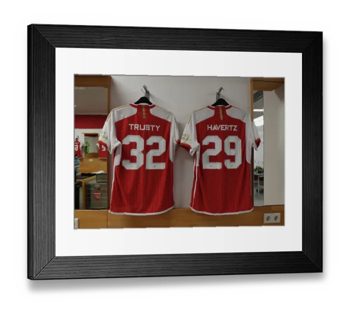 Framed Print : Arsenal FC: Pre-Season Preparation - Auston Trusty and Kai Havertz's Shirts in Arsenal Changing Room (Nuremberg, 2023)
