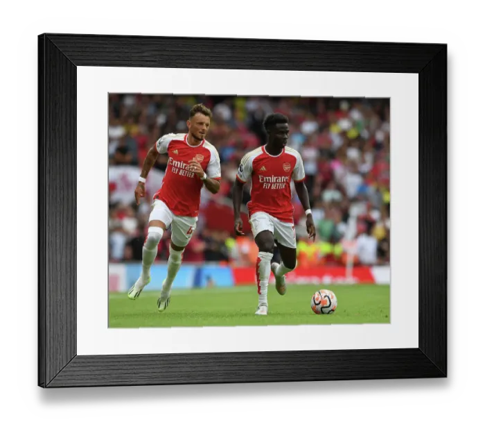 Framed Print : Arsenal's Saka and White in Action: Arsenal FC vs. Nottingham Forest, 2023-24 Premier League