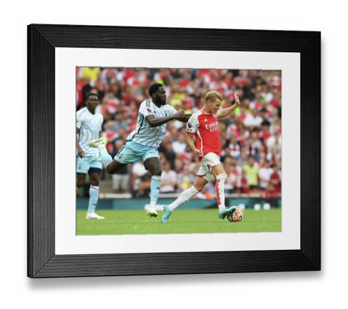 Framed Print : Arsenal vs. Nottingham Forest: Martin Odegaard Tackled by Orel Mangala in 2023-24 Premier League Clash Framed Print : Arsenal vs. Nottingham Forest: Martin Odegaard Tackled by Orel Mangala in 2023-24 Premier League Clash
