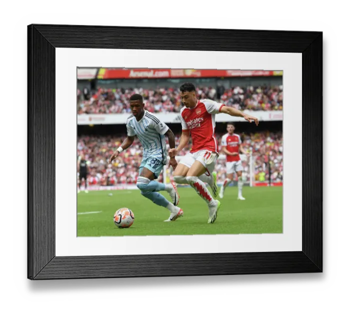 Framed Print : Arsenal's Martinelli Clashes with Forest's Danilo in 2023-24 Premier League Showdown Framed Print : Arsenal's Martinelli Clashes with Forest's Danilo in 2023-24 Premier League Showdown