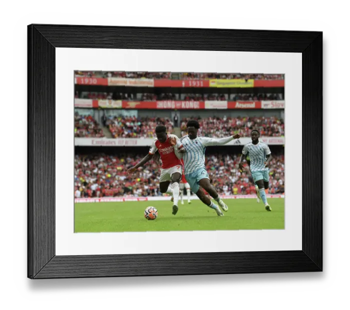 Framed Print : Arsenal's Bukayo Saka Faces Off Against Nottingham Forest's Ola Aina in 2023-24 Premier League Clash Framed Print : Arsenal's Bukayo Saka Faces Off Against Nottingham Forest's Ola Aina in 2023-24 Premier League Clash