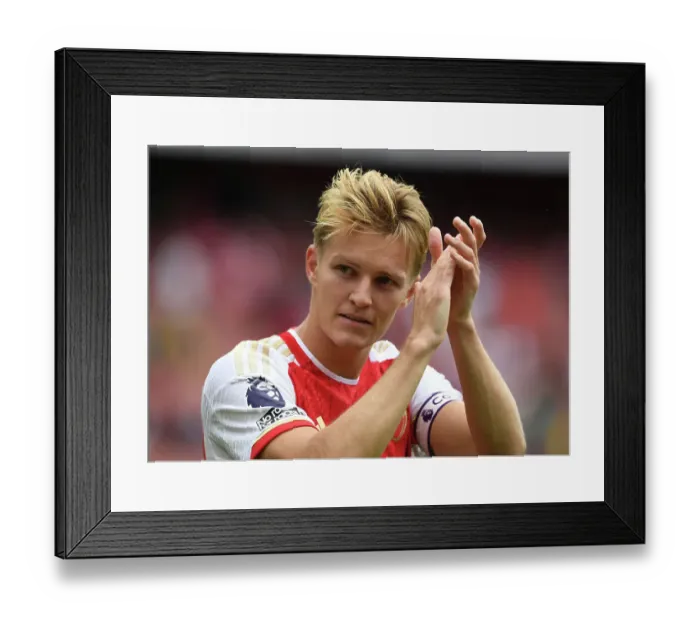 Framed Print : LONDON, ENGLAND - AUGUST 12: Martin Oedegaard of Arsenal applauds the fans after the team's victory in the Premier League match between Arsenal FC and Nottingham Forest at Emirates Stadium on August 12, 2023 in London, England