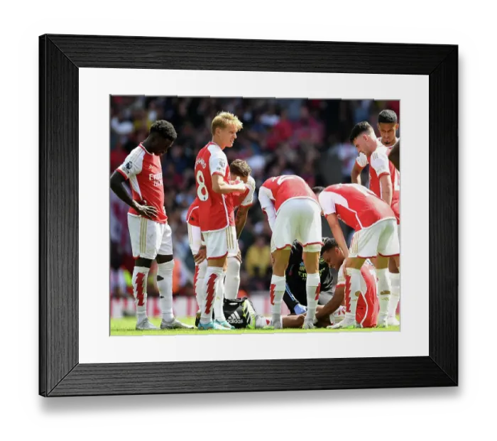 Framed Print : Arsenal's Jurrien Timber Receives Medical Attention During Arsenal vs Nottingham Forest (2023-24) Framed Print : Arsenal's Jurrien Timber Receives Medical Attention During Arsenal vs Nottingham Forest (2023-24)