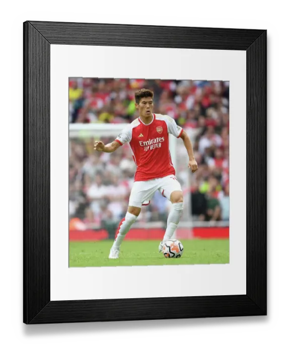 Framed Print : Arsenal's Tomiyasu in Action: Arsenal FC vs Nottingham Forest, Premier League 2023-24