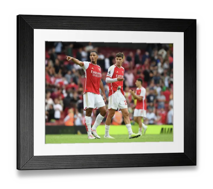 Framed Print : Arsenal's Saliba and Havertz Celebrate Victory Over Nottingham Forest (2023-24)