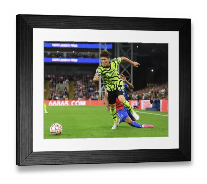 Framed Print : Arsenal's Tomiyasu Charges Forward in Crystal Palace Clash (2023-24 Premier League) Framed Print : Arsenal's Tomiyasu Charges Forward in Crystal Palace Clash (2023-24 Premier League)