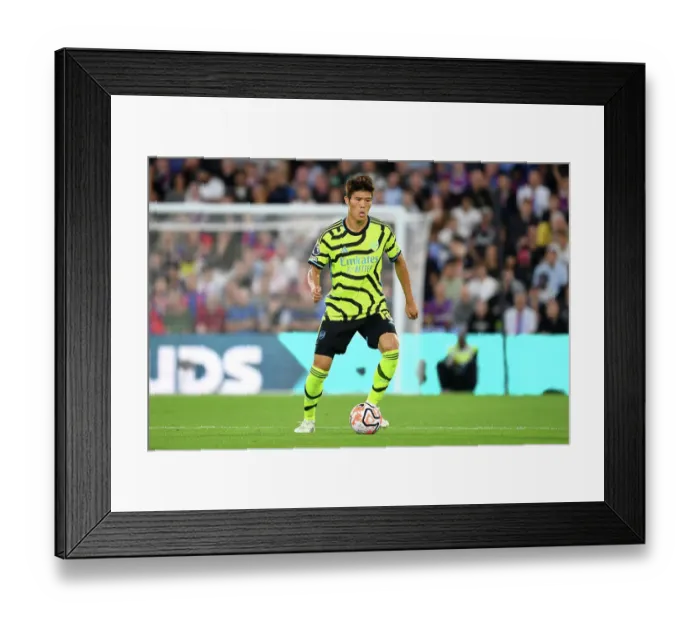 Framed Print : Arsenal's Tomiyasu Charges Forward: Premier League Battle against Crystal Palace (2023-24) Framed Print : Arsenal's Tomiyasu Charges Forward: Premier League Battle against Crystal Palace (2023-24)