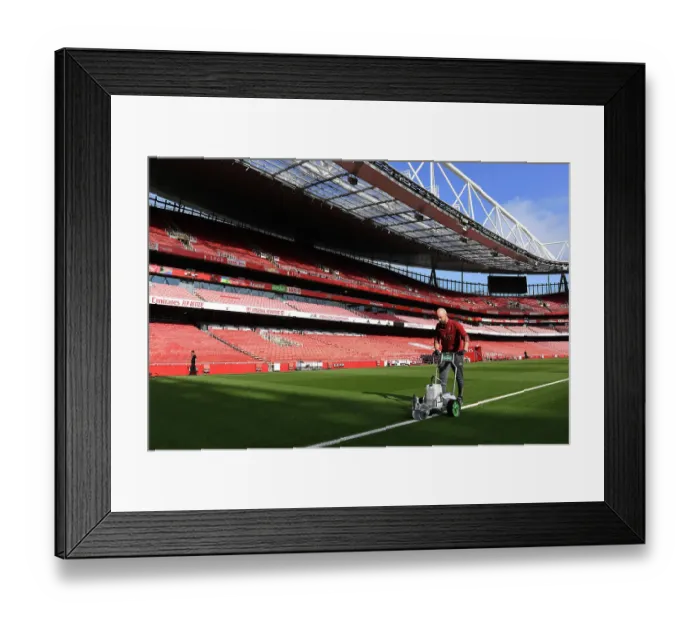 Framed Print : Arsenal's Emirates Stadium: Grounds Crew Prepare for Arsenal v Fulham Premier League Clash (2023-24)