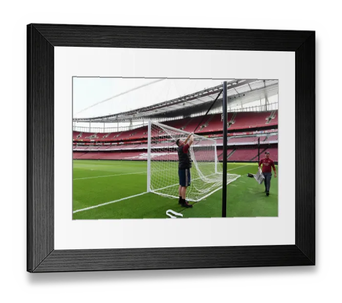 Framed Print : Preparing Emirates Stadium: Arsenal's Grounds Team Readies the Field for Arsenal vs. Fulham (2023-24)