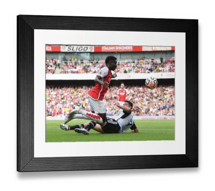 Framed Print : Arsenal's Bukayo Saka Faces Off Against Fulham's Raul Jimenez in Intense Premier League Clash (2023-24) Framed Print : Arsenal's Bukayo Saka Faces Off Against Fulham's Raul Jimenez in Intense Premier League Clash (2023-24)