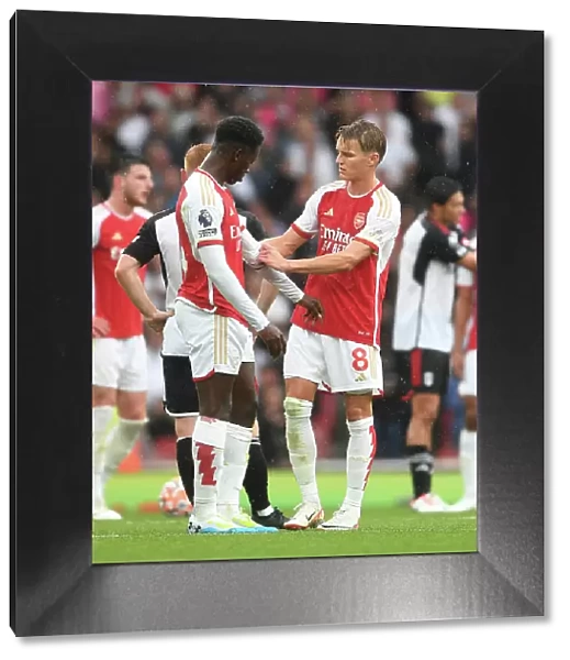 Arsenal's Martin Odegaard and Eddie Nketiah Share a Moment during Arsenal vs. Fulham (2023-24)