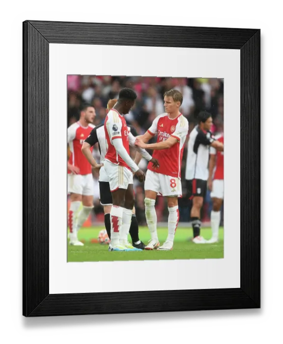 Framed Print : Arsenal's Martin Odegaard and Eddie Nketiah Share a Moment during Arsenal vs. Fulham (2023-24) Framed Print : Arsenal's Martin Odegaard and Eddie Nketiah Share a Moment during Arsenal vs. Fulham (2023-24)