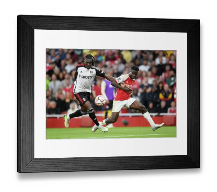 Framed Print : Arsenal's Bukayo Saka Fights for Possession Against Fulham in 2023-24 Premier League Clash