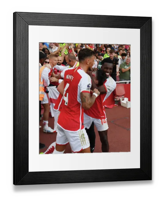 Framed Print : Arsenal's Double Strike: Rice, White, and Nketiah Celebrate Over Manchester United in 2023-24 Premier League