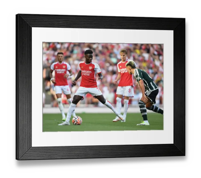 Framed Print : Arsenal's Bukayo Saka Faces Off Against Manchester United in the Premier League (2023-24) Framed Print : Arsenal's Bukayo Saka Faces Off Against Manchester United in the Premier League (2023-24)