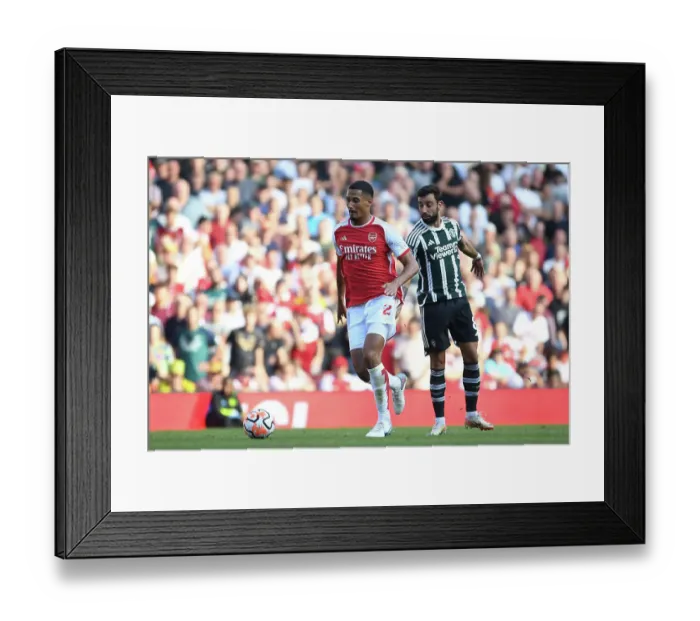 Framed Print : Arsenal's Saliba Chases Victory: Arsenal FC vs Manchester United, Premier League 2023-24