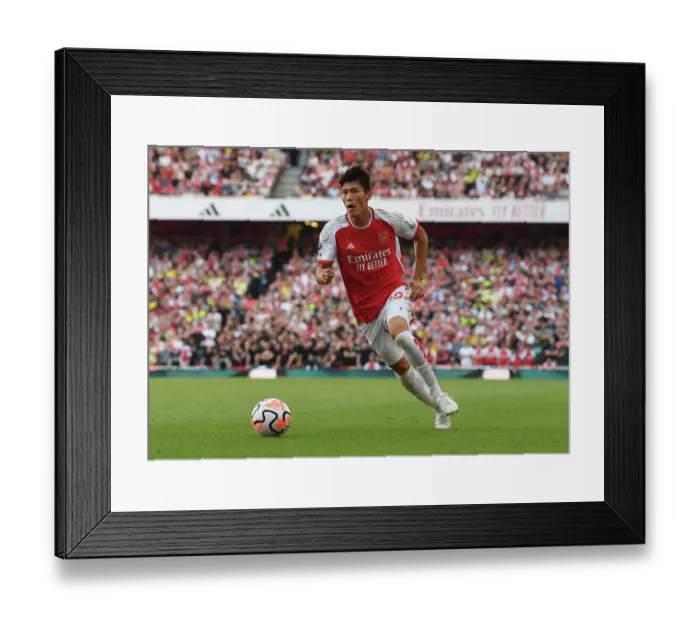 Framed Print : Arsenal vs Manchester United: Tomiyasu in Action at the Emirates Stadium (2023-24)