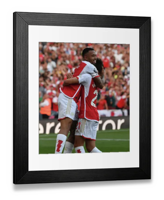 Framed Print : Arsenal's Triumph: Gabriel Jesus and Fabio Vieira Celebrate Third Goal Against Manchester United (2023-24)