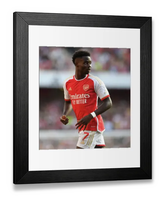 Framed Print : Bukayo Saka vs Manchester United: Intense 2023-24 Premier League Showdown
