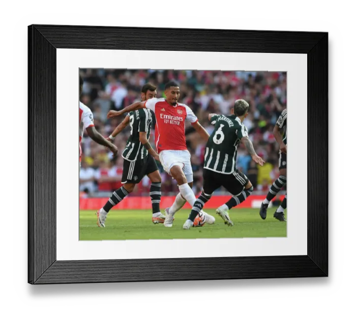 Framed Print : Arsenal's Saliba Takes on Manchester United's Martinez in Premier League Showdown (2023-24) Framed Print : Arsenal's Saliba Takes on Manchester United's Martinez in Premier League Showdown (2023-24)