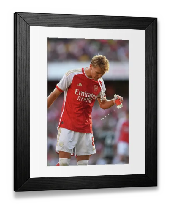 Framed Print : Arsenal vs Manchester United: Martin Ødegaard's Emotional Moment at Emirates Stadium (2023-24)