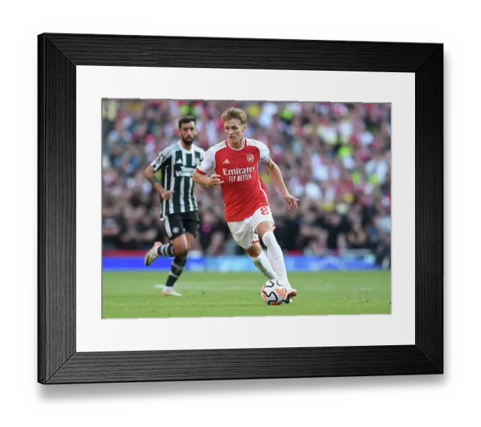 Framed Print : Arsenal vs Manchester United: Martin Odegaard Shines in the 2023-24 Premier League Clash at Emirates Stadium
