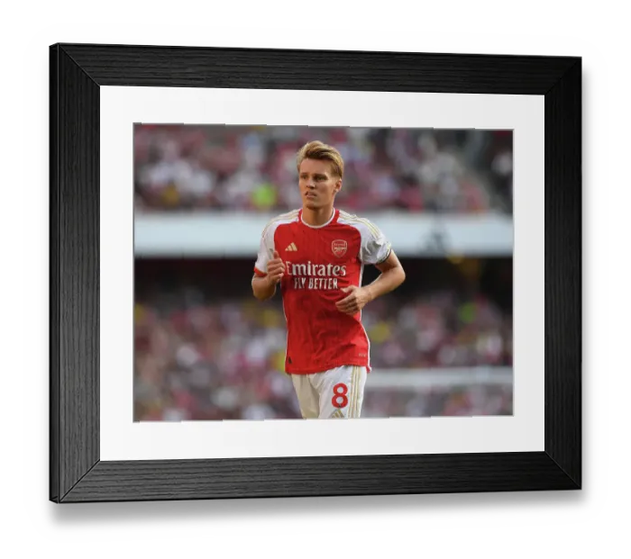 Framed Print : Martin Odegaard's Brilliant Display: Arsenal's Dominant Victory Over Manchester United in the 2023-24 Premier League