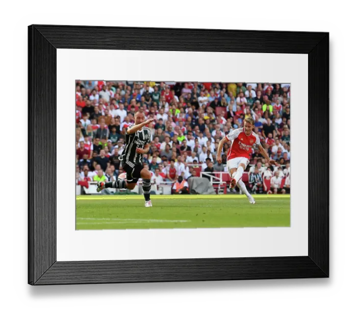 Framed Print : Arsenal Takes the Lead: Martin Ødegaard Scores First Goal Against Manchester United (2023-24)