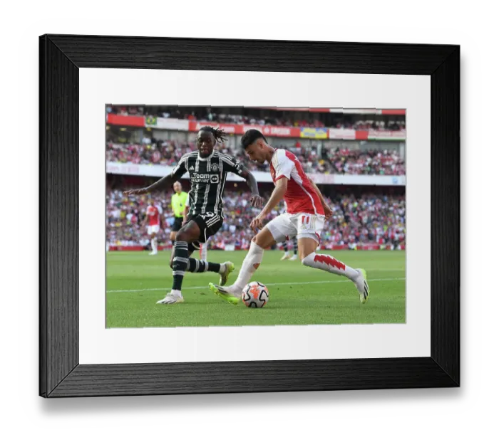 Framed Print : Arsenal's Martinelli Clashes with Manchester United's Wan-Bissaka in 2023-24 Premier League Showdown