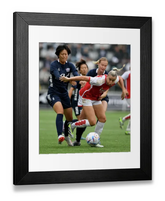 Framed Print : Arsenal's Alessia Russo Clashes with Soari Takarada in UEFA Champions League Showdown