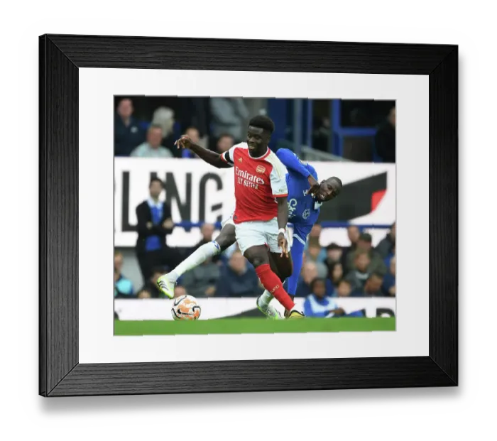 Framed Print : Saka Scores Past Doucoure: Everton vs. Arsenal, Premier League 2023-24