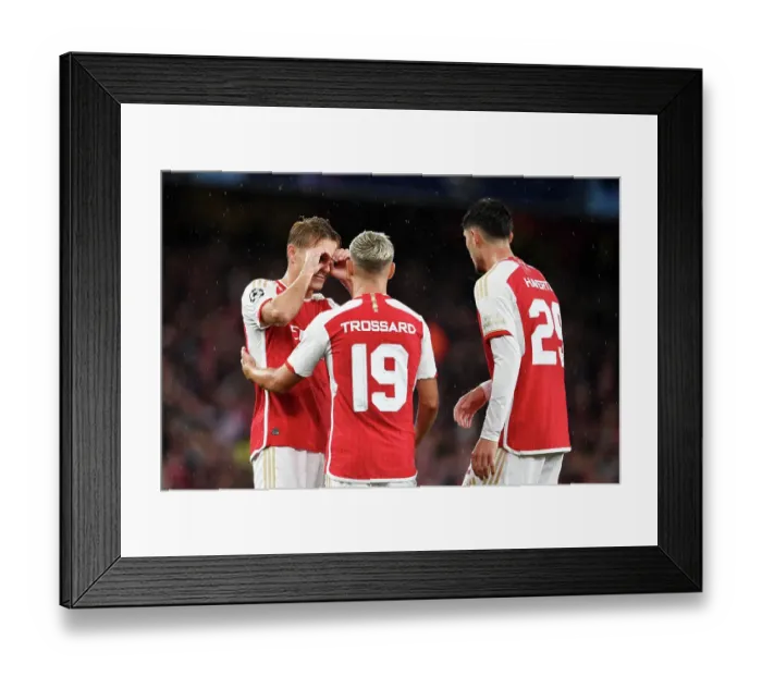 Framed Print : Arsenal Celebrates Double Strike: Trossard and Odegaard Score Against PSV Eindhoven in Champions League 2023 / 24