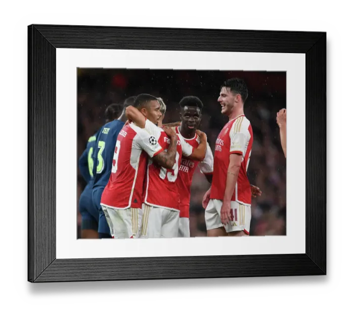 Framed Print : Arsenal's Triumph: Trossard, Jesus, Saka & Ric Celebrate 3rd Goal vs PSV Eindhoven (UEFA Champions League 2023 / 24)
