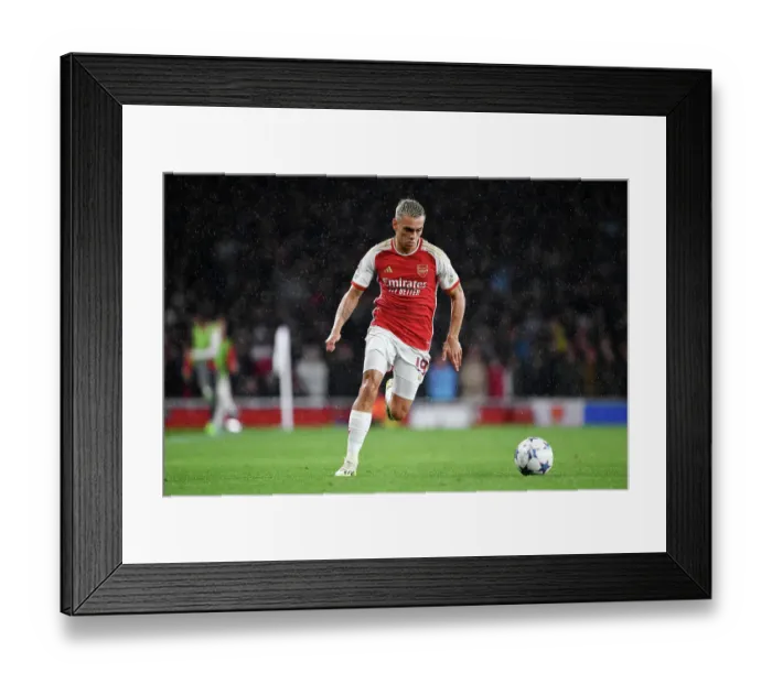 Framed Print : Arsenal's Thrilling Champions League Clash: Trossard's Epic Dash at Emirates Stadium Framed Print : Arsenal's Thrilling Champions League Clash: Trossard's Epic Dash at Emirates Stadium