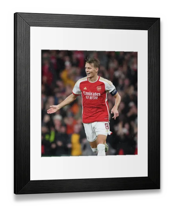 Framed Print : Arsenal's Odegaard Scores Fourth Goal in Champions League Victory over PSV Eindhoven