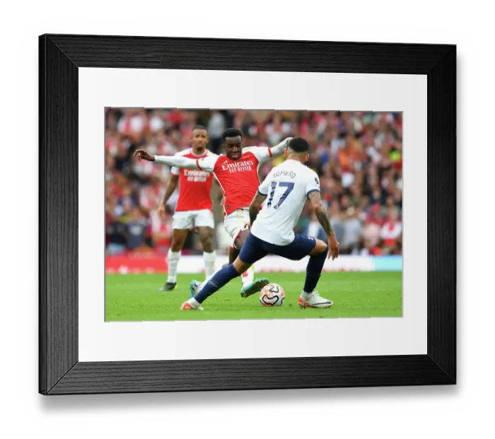 Framed Print : Arsenal vs. Tottenham: Nketiah Passes the Ball in the 2023-24 Premier League Clash at Emirates Stadium