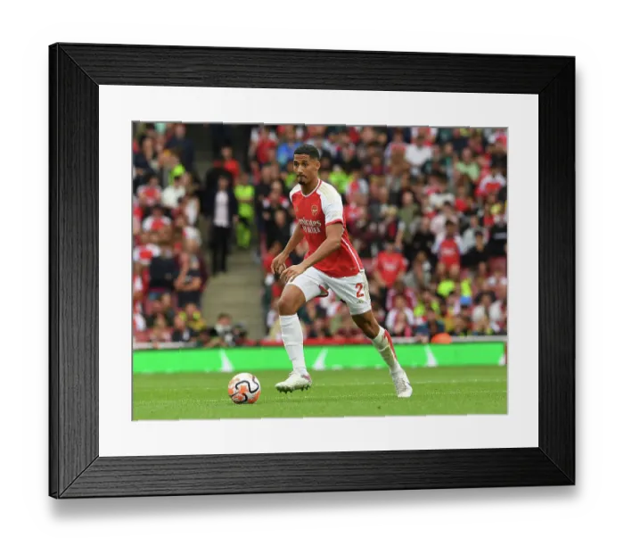 Framed Print : Arsenal's William Saliba Stands Firm Against Tottenham in the 2023-24 Premier League Battle Framed Print : Arsenal's William Saliba Stands Firm Against Tottenham in the 2023-24 Premier League Battle
