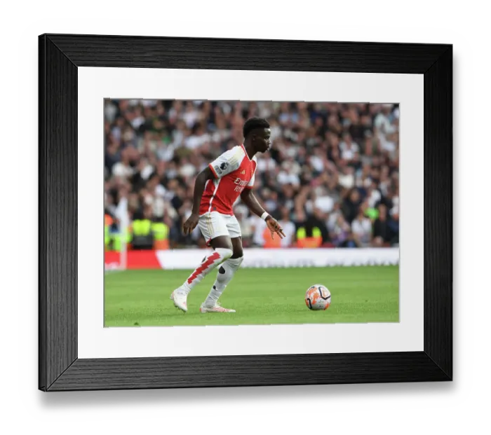 Framed Print : Arsenal's Bukayo Saka Faces Off Against Tottenham in the 2023-24 Premier League Battle