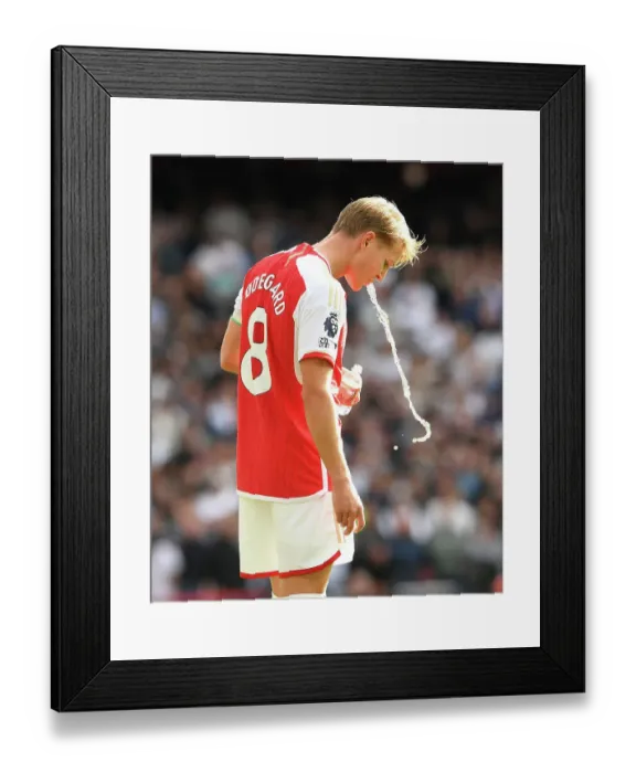 Framed Print : Martin Odegaard vs. Tottenham: The Thrilling 2023-24 Premier League Clash at Emirates Stadium Framed Print : Martin Odegaard vs. Tottenham: The Thrilling 2023-24 Premier League Clash at Emirates Stadium