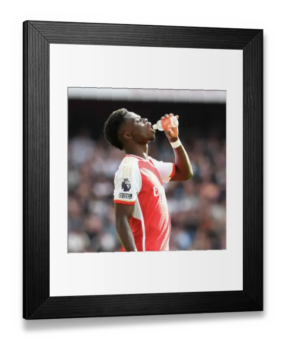 Framed Print : Arsenal's Bukayo Saka Goes Head-to-Head with Tottenham in the Intense 2023-24 Premier League Showdown