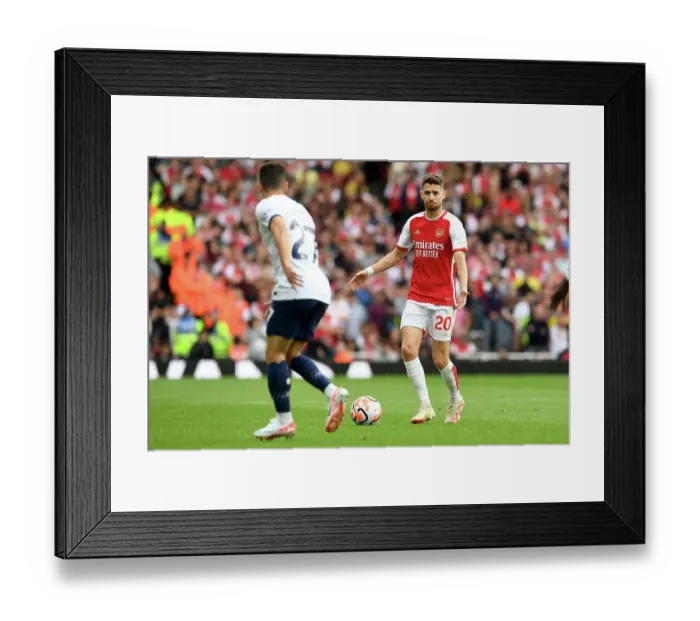Framed Print : Arsenal's Jorginho Charges Forward in Arsenal v Tottenham Premier League Clash (2023-24)