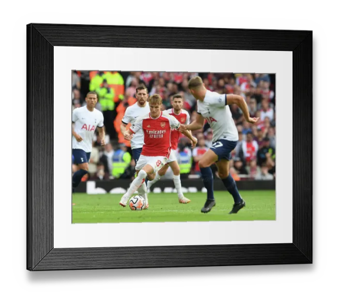 Framed Print : Arsenal's Martin Odegaard Faces Off Against Tottenham in the 2023-24 Premier League Showdown at Emirates Stadium Framed Print : Arsenal's Martin Odegaard Faces Off Against Tottenham in the 2023-24 Premier League Showdown at Emirates Stadium